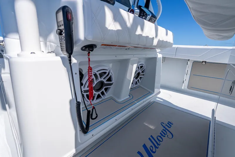 Slide: The Image of 2026 Yellowfin 32 Offshore boat interior with speakers and communication equipment. - 48