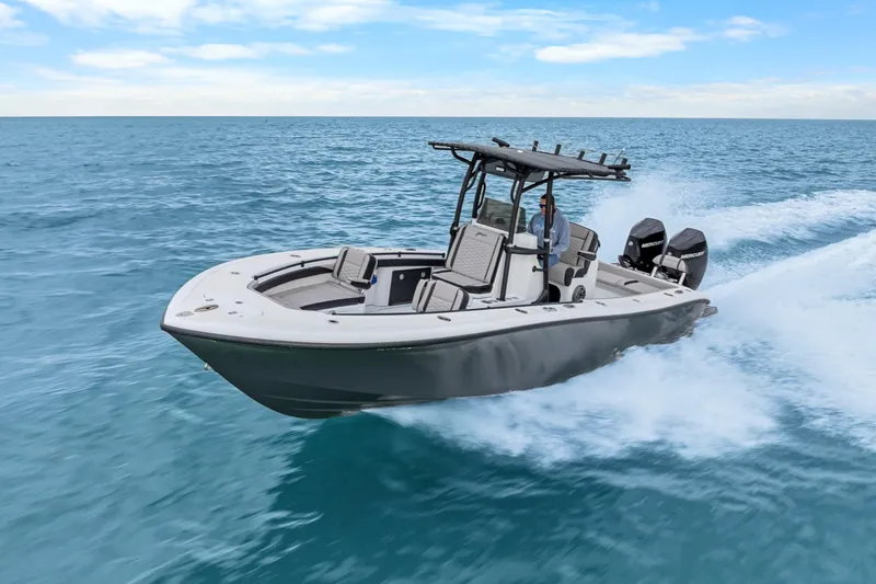 The Image of 2024 Yellowfin 26 Hybrid boat cruising on open water, showcasing sleek design and powerful engines. - 0