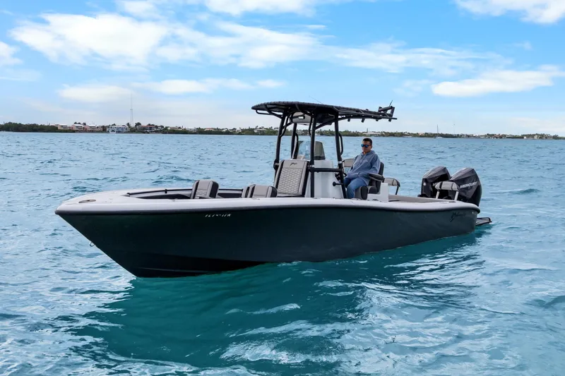 Slide: The Image of 2024 Yellowfin 26 Hybrid boat on blue ocean under clear sky. - 15