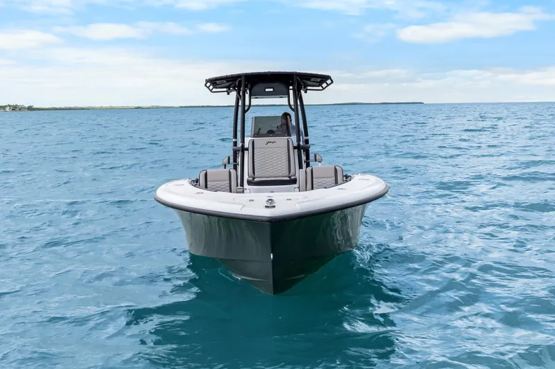 Slide: The Image of 2024 Yellowfin 26 Hybrid boat on open ocean under blue sky. - 16