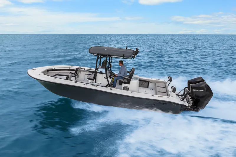 Slide: The Image of 2024 Yellowfin 26 Hybrid boat cruising on open ocean waters. - 3