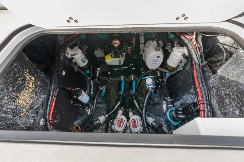 Slide: The Image of 2024 Yellowfin 26 Hybrid boat engine compartment with wiring and components. - 35