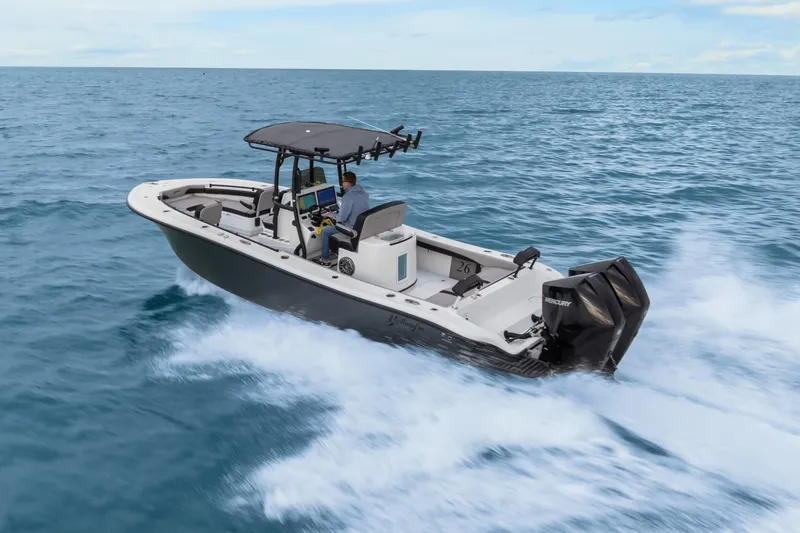 Slide: The Image of 2024 Yellowfin 26 Hybrid boat cruising on open ocean waters. - 4