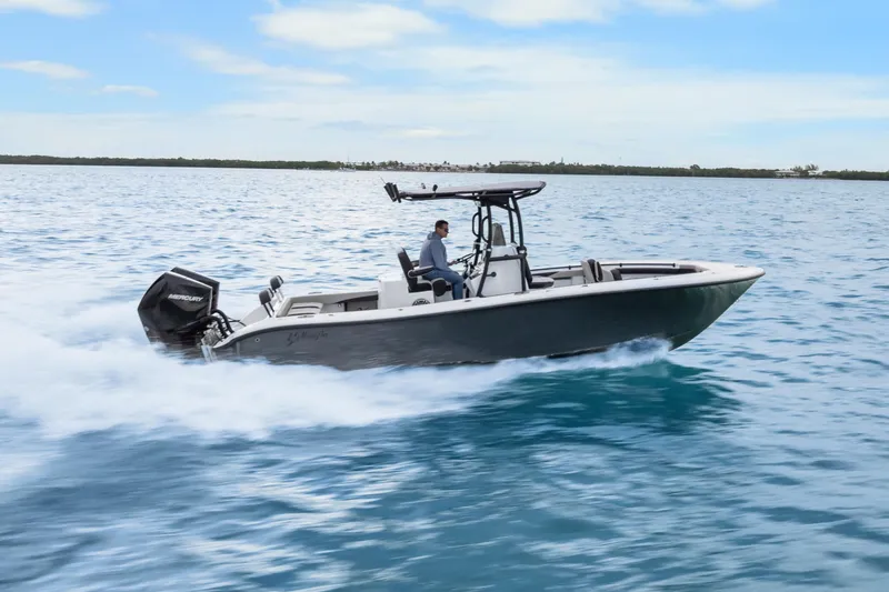 Slide: The Image of 2024 Yellowfin 26 Hybrid boat speeding on open water. - 5