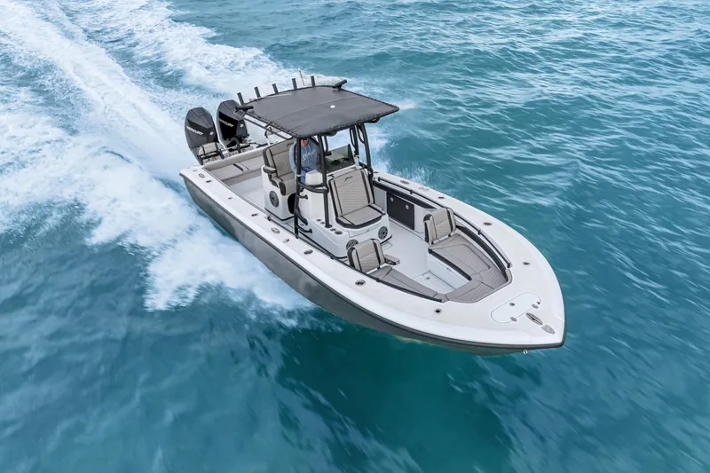 Slide: The Image of 2024 Yellowfin 26 Hybrid boat cruising on open water, showcasing sleek design and performance. - 6