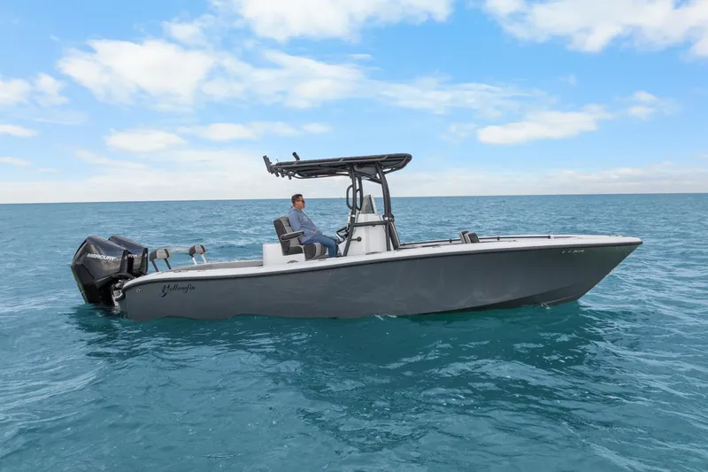 Slide: The Image of 2024 Yellowfin 26 Hybrid boat on open water, featuring sleek design and powerful engines. - 8