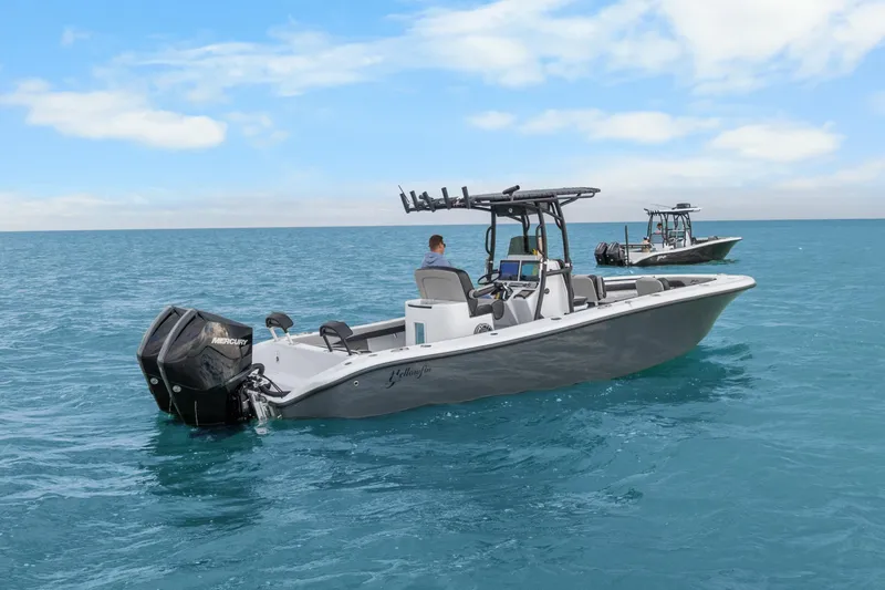 Slide: The Image of 2024 Yellowfin 26 Hybrid boat on open blue ocean under clear sky. - 9