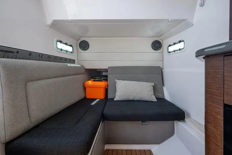 Slide: The Image of 2019 Everglades 435 Center Console cabin interior with seating, storage, and modern design. - 12