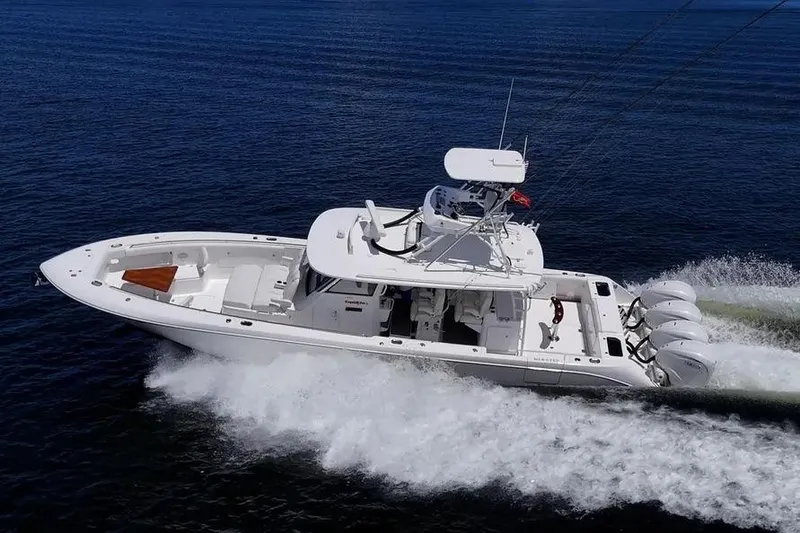 Slide: The Image of 2019 Everglades 435 Center Console boat cruising on open water. - 9