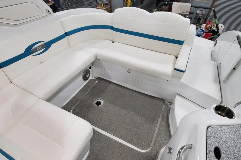 Slide: The Image of 2009 Formula 310 Bowrider interior with white seating and blue accents. - 12