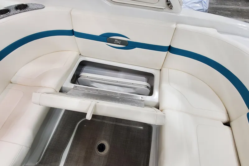 Slide: The Image of 2009 Formula 310 Bowrider interior with white seating and storage compartment. - 14