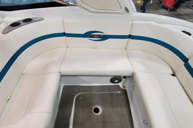 Slide: The Image of 2009 Formula 310 Bowrider interior with white seating and blue accents. - 16
