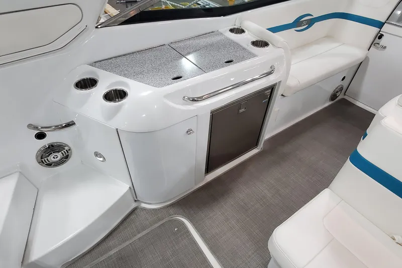 Slide: The Image of 2009 Formula 310 Bowrider interior with seating, cup holders, and storage. - 17