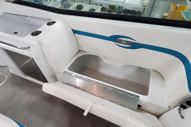 Slide: The Image of 2009 Formula 310 Bowrider interior with storage compartment and cup holders. - 25