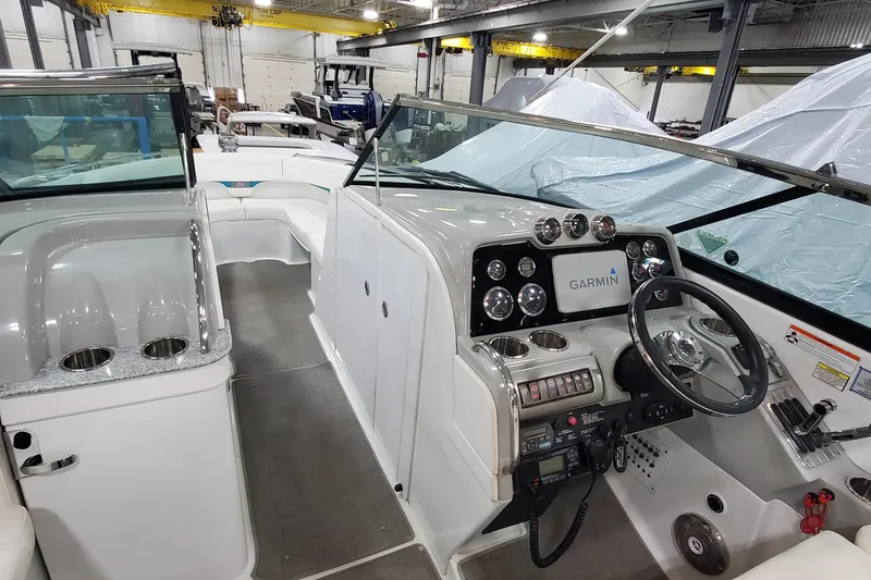 Slide: The Image of 2009 Formula 310 Bowrider interior with Garmin navigation, sleek dashboard, and spacious seating. - 29