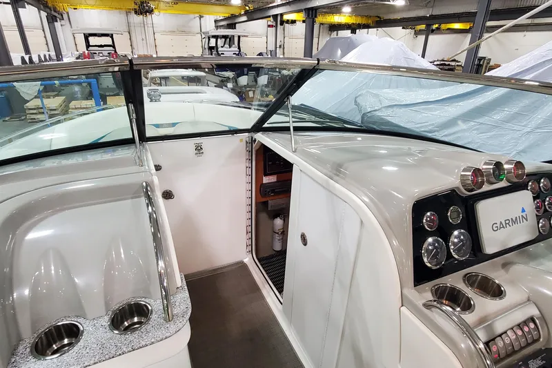 Slide: The Image of 2009 Formula 310 Bowrider cockpit with Garmin navigation, sleek design, and modern controls. - 30