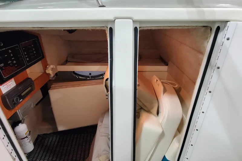 Slide: The Image of 2009 Formula 310 Bowrider cabin interior with control panel and seating. - 32