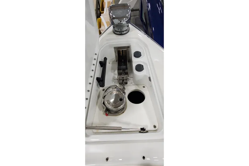 Slide: The Image of 2009 Formula 310 Bowrider anchor compartment with stainless steel fittings and winch. - 37