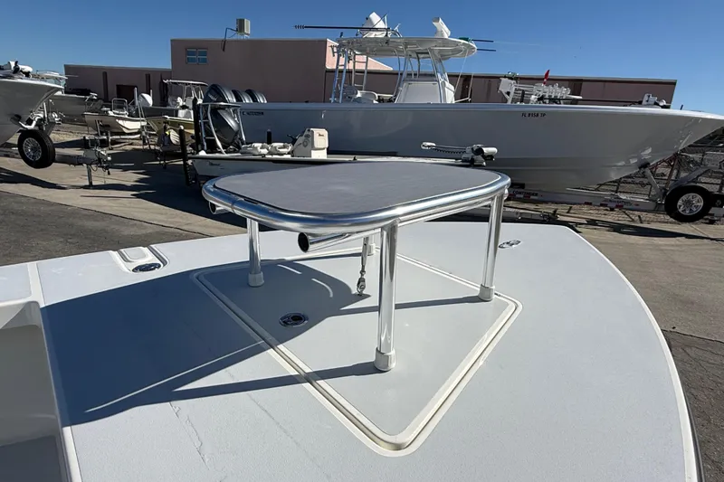 Slide: The Image of 2026 Maverick 17 HPX-S boat on display at a marina, featuring a raised platform. - 4