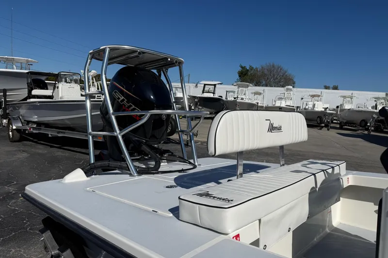 Slide: The Image of 2026 Maverick 17 HPX-S boat with Yamaha engine, parked in a marina. - 6