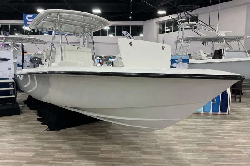 The Image of 2026 Contender 29 Bay boat displayed indoors on wooden flooring. - 1