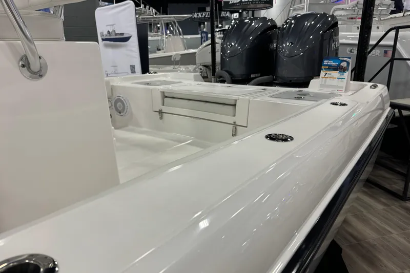 Slide: The Image of 2026 Contender 29 Bay boat interior with dual engines, sleek design, and modern features. - 14
