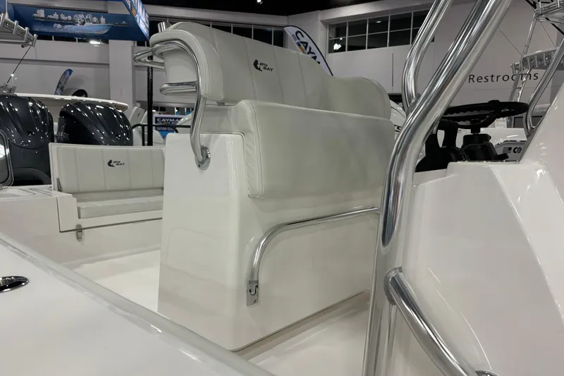 Slide: The Image of 2026 Contender 29 Bay boat interior with white seating and chrome details. - 16