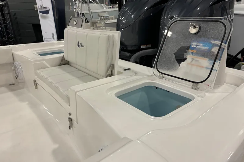 Slide: The Image of 2026 Contender 29 Bay boat interior with seating and storage compartments. - 18