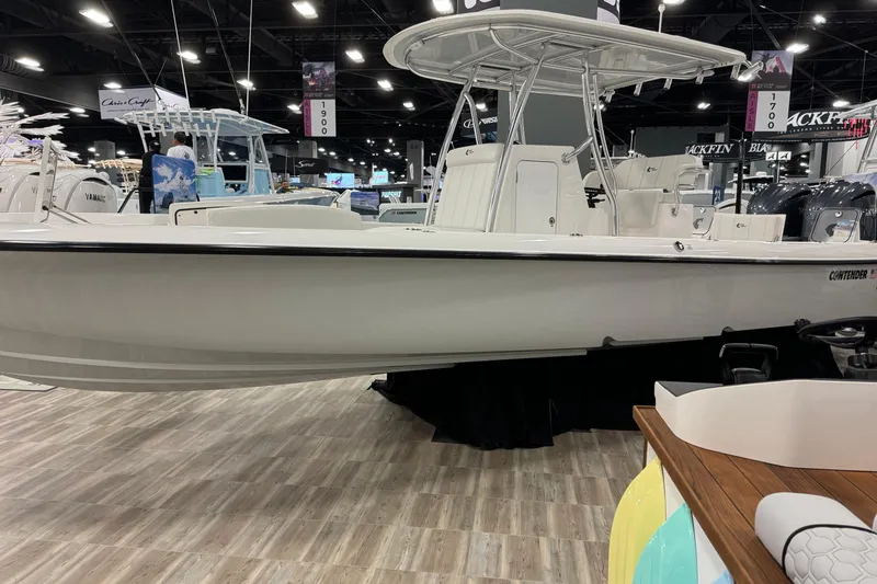 Slide: The Image of 2026 Contender 29 Bay boat displayed at an indoor boat show. - 3