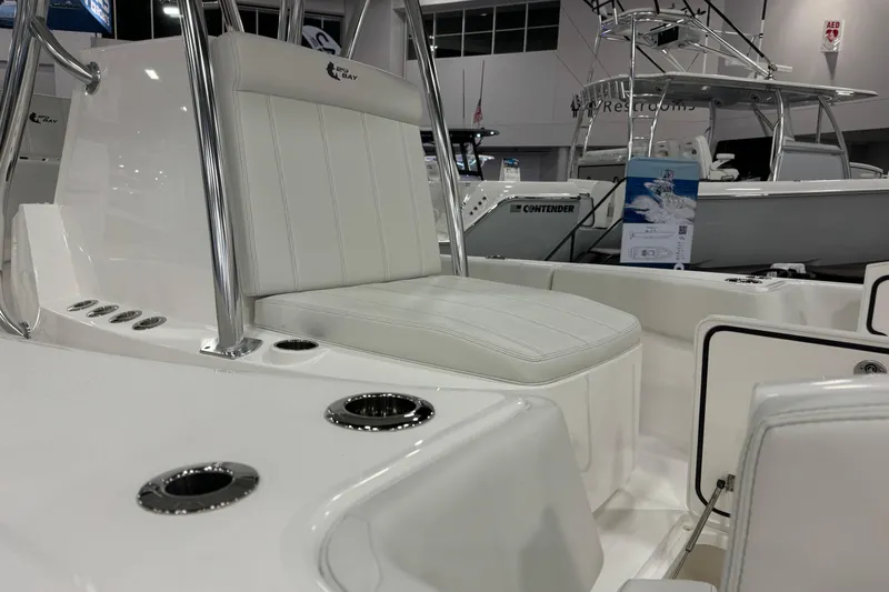 Slide: The Image of 2026 Contender 29 Bay boat interior with white seating and chrome accents. - 21