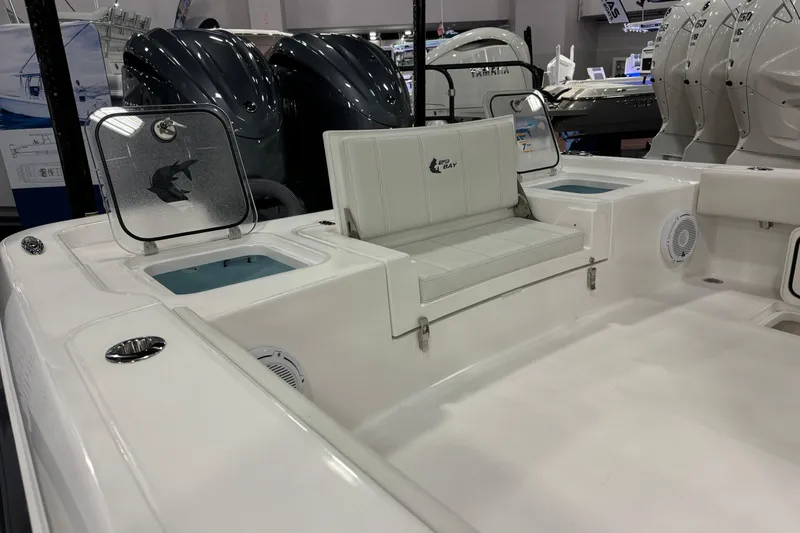 Slide: The Image of 2026 Contender 29 Bay boat interior with seating and storage compartments. - 23