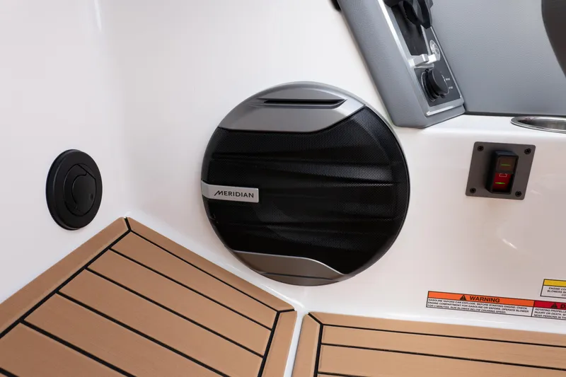 Slide: The Image of 2026 MasterCraft XT24 boat interior with Meridian speaker and control panel. - 14
