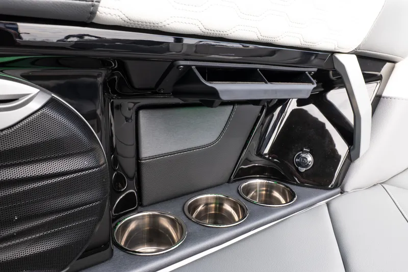 Slide: The Image of Interior of 2026 MasterCraft XT24 boat with cup holders and speaker. - 27