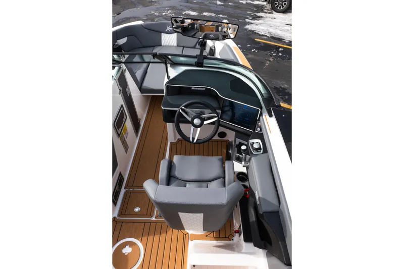 Slide: The Image of 2026 MasterCraft XT24 boat interior with sleek design and modern dashboard. - 31