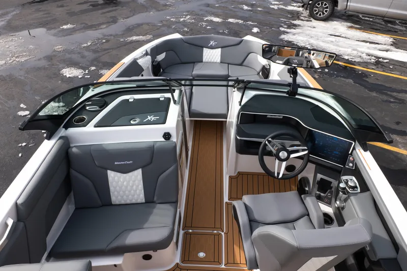 Slide: The Image of 2026 MasterCraft XT24 boat interior with modern dashboard and seating. - 32