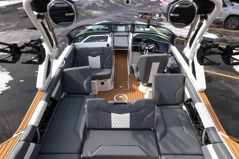 Slide: The Image of 2026 MasterCraft XT24 boat interior with sleek gray seating and modern dashboard. - 35