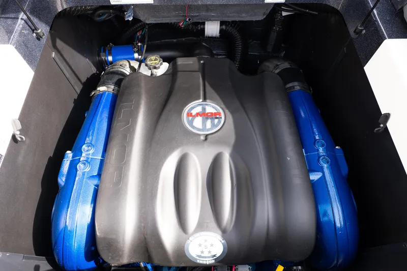 Slide: The Image of 2026 MasterCraft XT24 engine compartment with Ilmor engine, featuring blue components. - 39