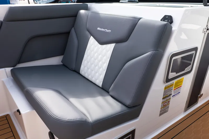 Slide: The Image of 2026 MasterCraft XT24 boat seat with gray and white upholstery. - 40