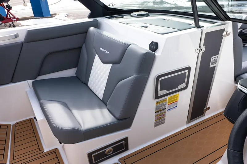 Slide: The Image of 2026 MasterCraft XT24 boat interior with gray seating and modern design. - 42