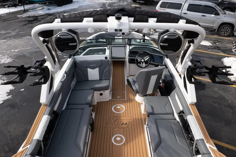 Slide: The Image of 2026 MasterCraft XT24 boat interior with sleek seating and modern dashboard design. - 47