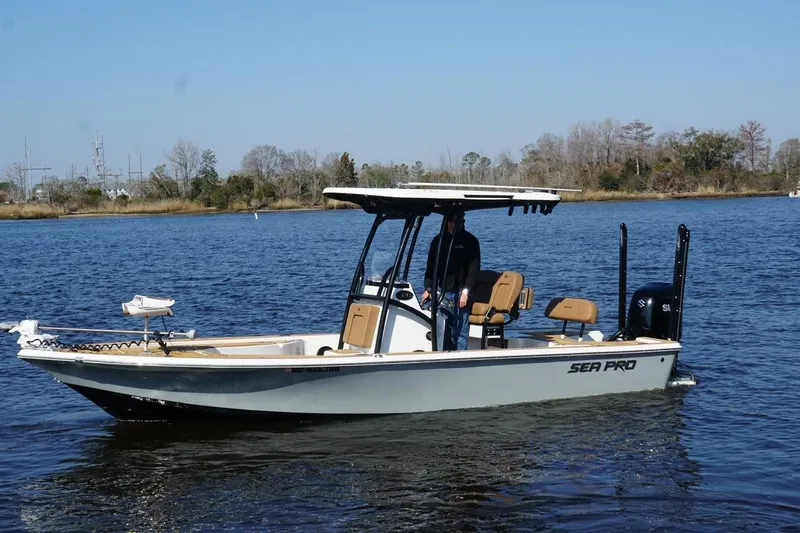 The Image of 2022 Sea Pro 228 Bay boat on calm water, featuring sleek design and modern amenities. - 0