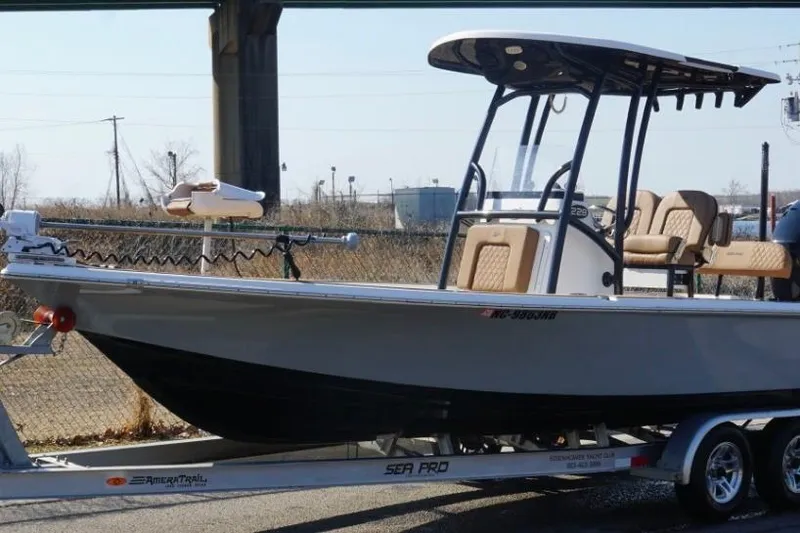Slide: The Image of 2022 Sea Pro 228 Bay boat on trailer, parked outdoors. - 14