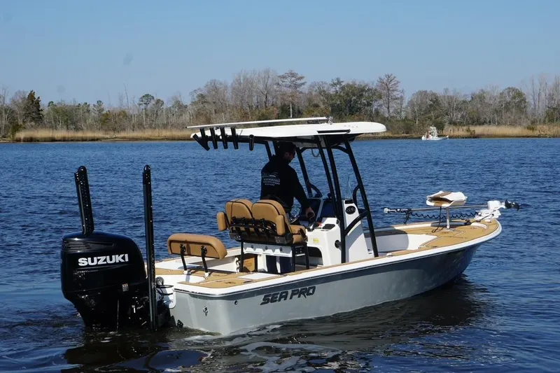 Slide: The Image of 2022 Sea Pro 228 Bay boat with Suzuki engine on a calm lake. - 5