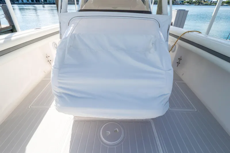 Slide: The Image of 2015 Intrepid 400 Center Console boat interior with covered seating area. - 121