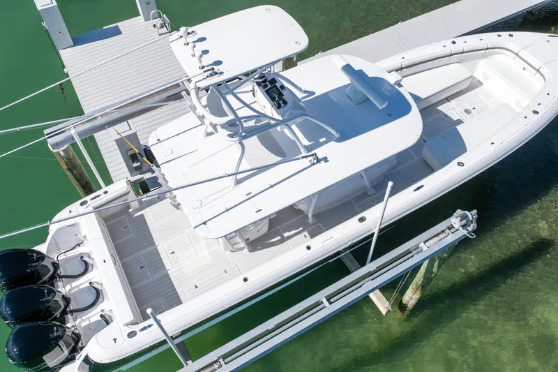 Slide: The Image of 2015 Intrepid 400 Center Console boat docked on clear water. - 19