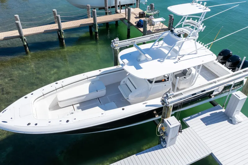 Slide: The Image of 2015 Intrepid 400 Center Console boat docked in clear water, aerial view. - 23