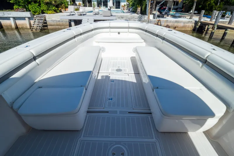 Slide: The Image of 2015 Intrepid 400 Center Console boat interior with white cushioned seating. - 4