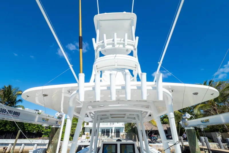 Slide: The Image of 2015 Intrepid 400 Center Console boat with tower against clear blue sky. - 46