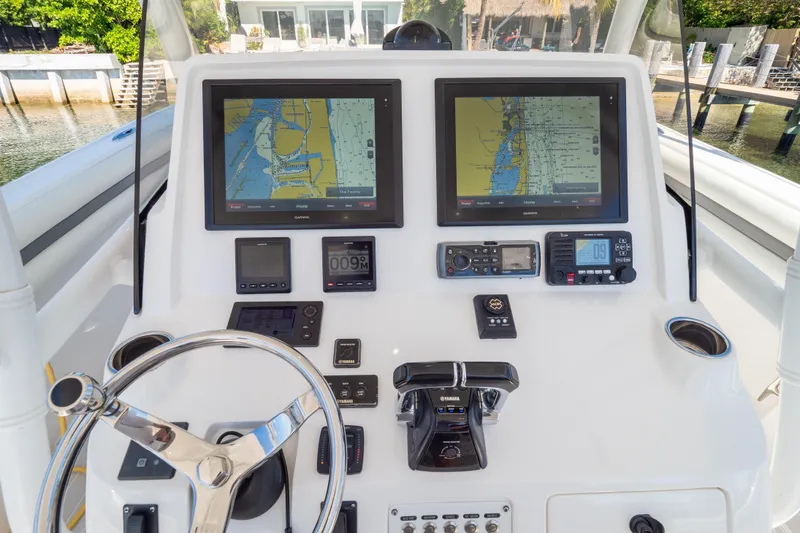 Slide: The Image of Control panel of a 2015 Intrepid 400 Center Console boat with navigation screens. - 51