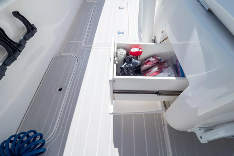 Slide: The Image of Open storage drawer on 2015 Intrepid 400 Center Console boat deck. - 58